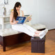 Woman using the Brown Collapsible Ottoman as a foot stool