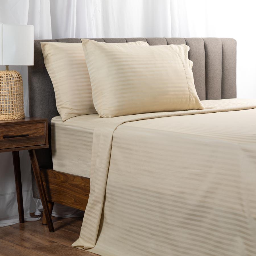 Beige Cotton Sheets on a bed