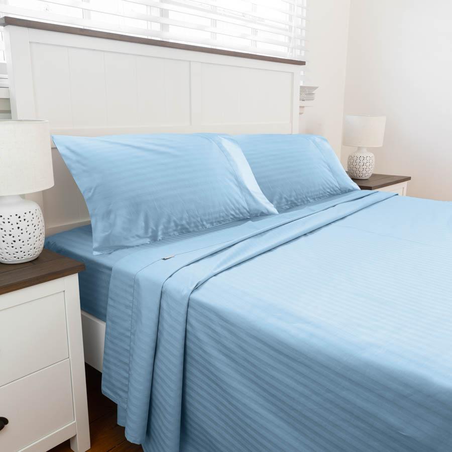 Bed set up with Light Blue Cotton Sheets