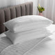 Two pillows on a bed with Super weave Sheets