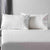 Pillows on a bed ontop of a Royal Deluxe Super Weave Sheets
