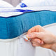 Person zipping up a Straight2Sleep Mattress Topper