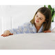 Woman touching Royal Deluxe Breathable Cotton Dream Sheet on a bed