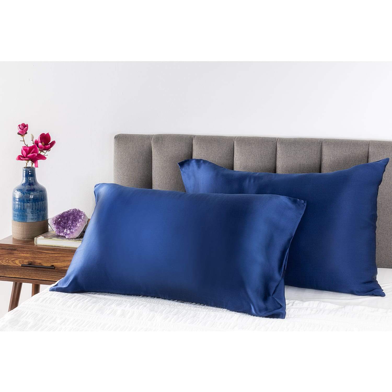 Midnight Blue Youth Silk Pillow Case on pillows in a bed