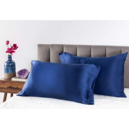 Midnight Blue Youth Silk Pillow Case on pillows in a bed