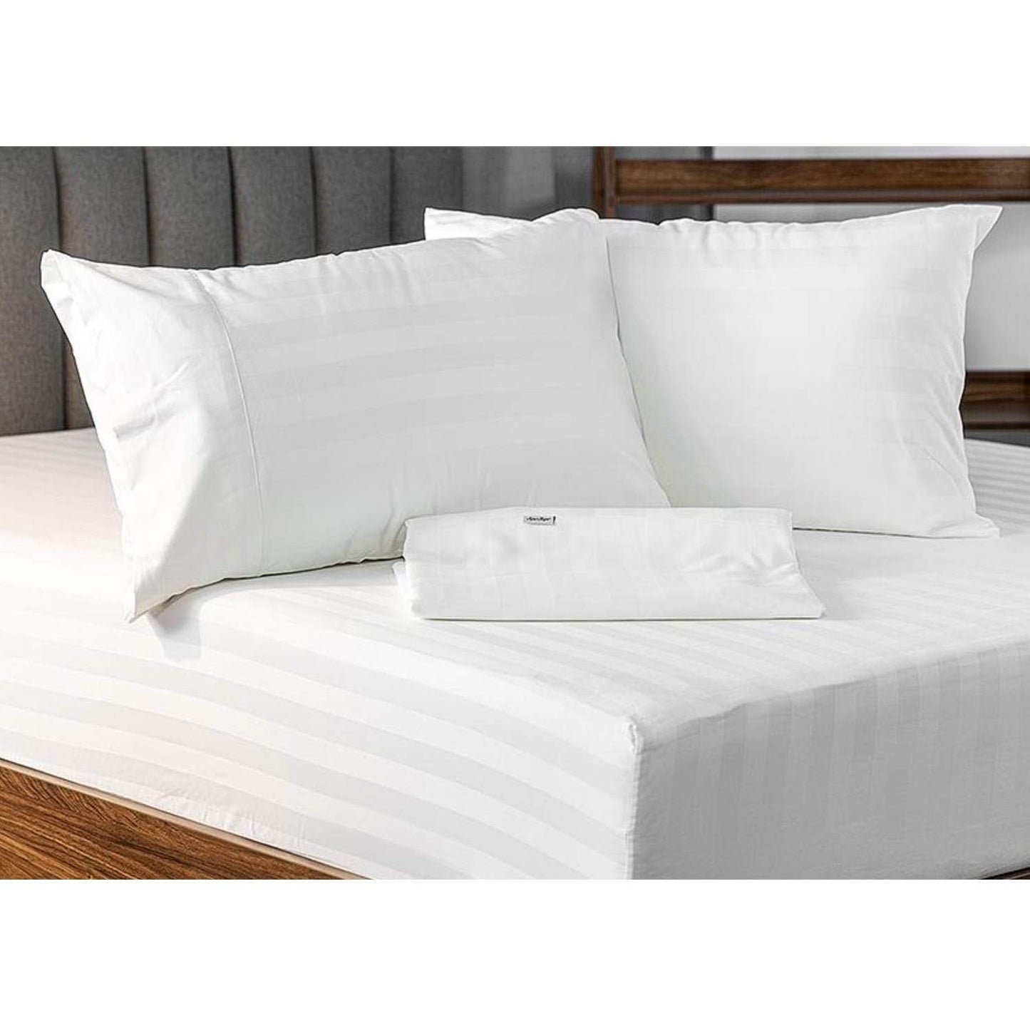 Royal Deluxe Breathable Cotton Dream Sheet Set on a bed with an extra folded sheet