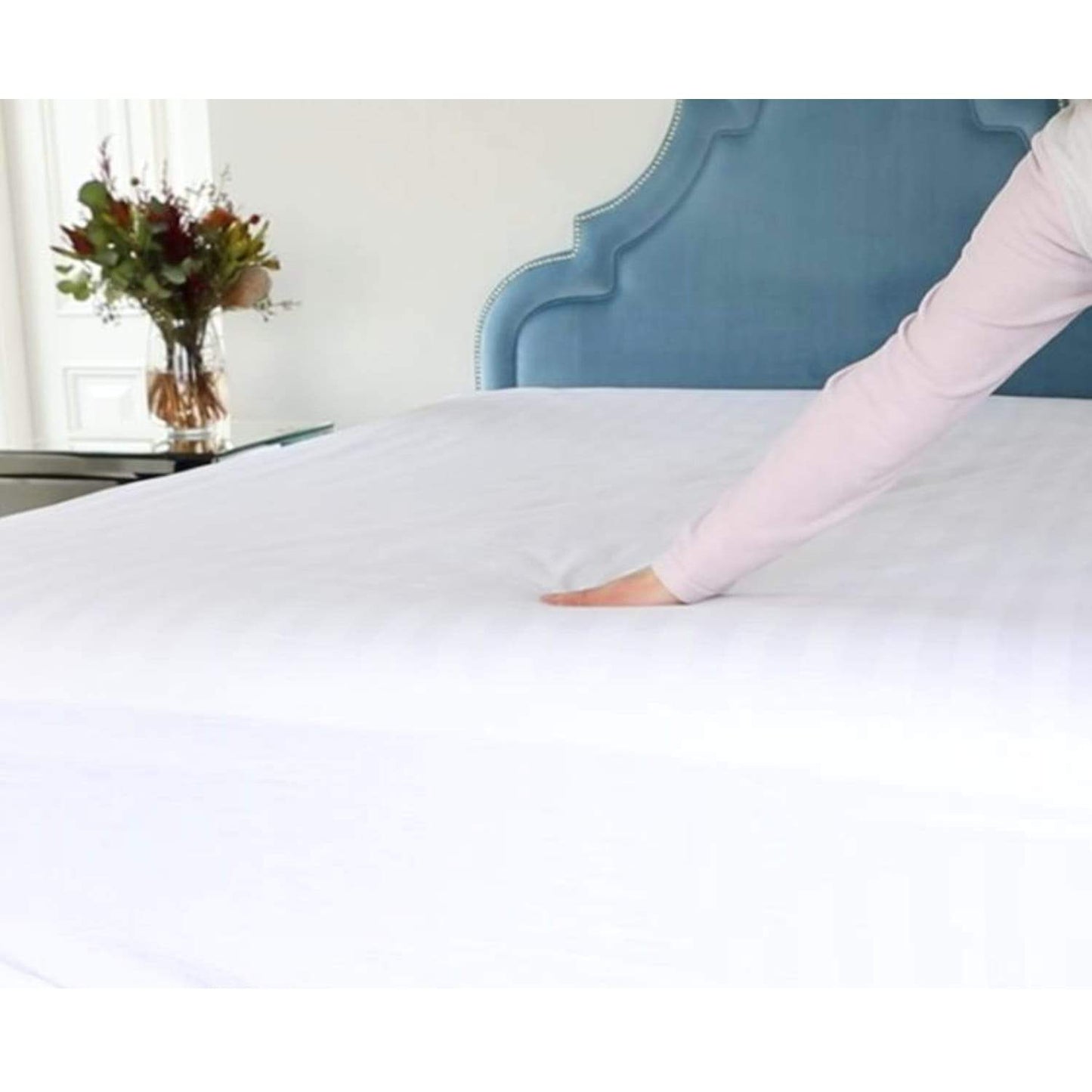 Woman touching Royal Deluxe Breathable Cotton Dream Sheet on a bed